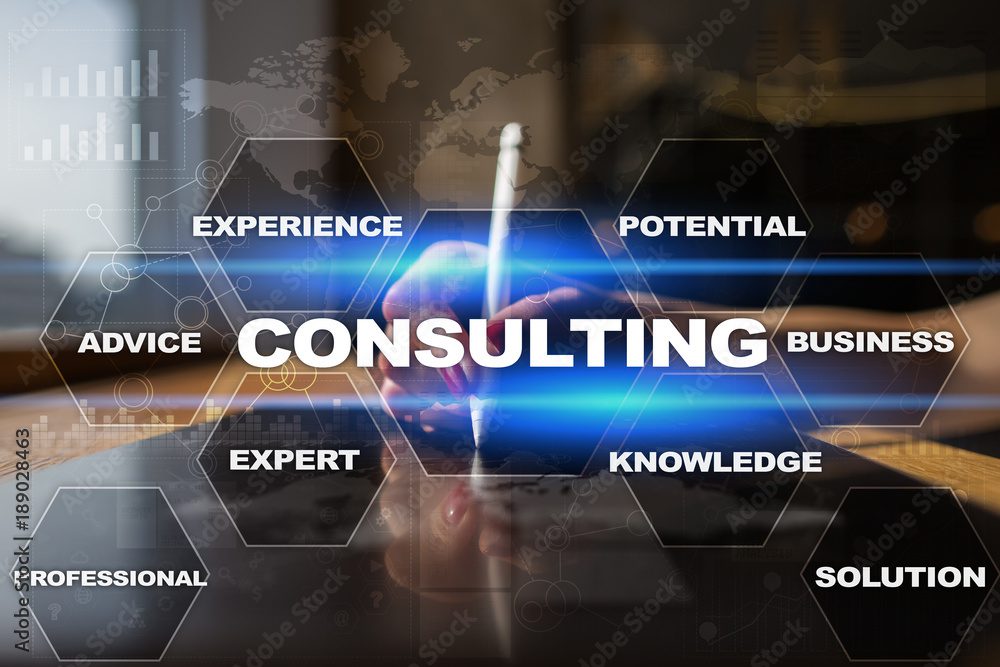 A person holding a pen with the word consulting written on it.