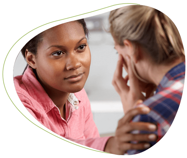 A woman is talking to another person in front of her.