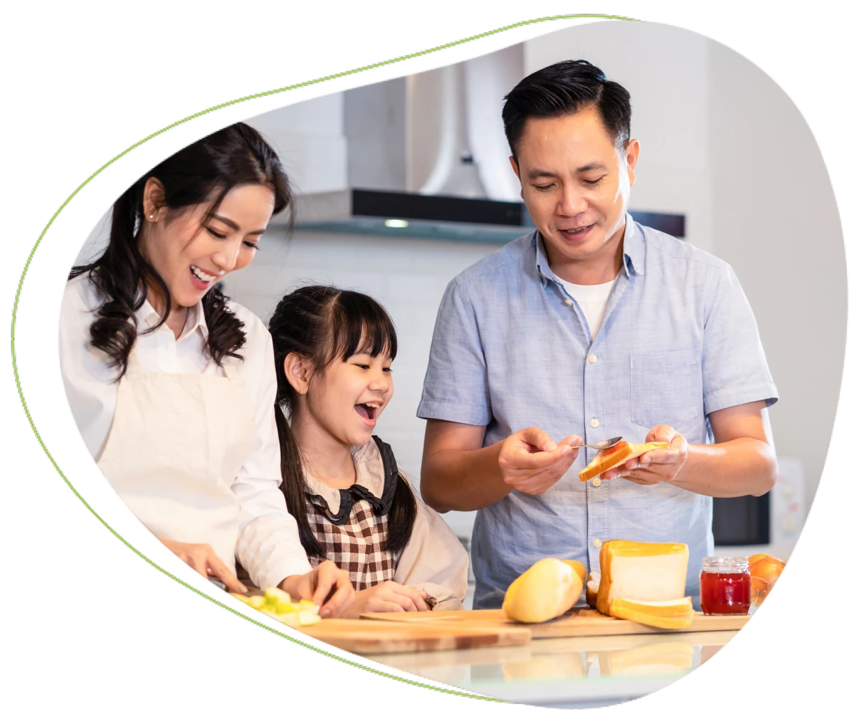 Family happily preparing food in the kitchen.
