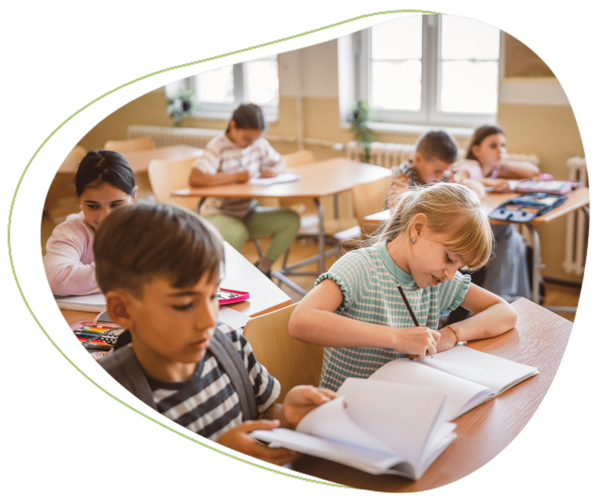 Children studying in a classroom setting.