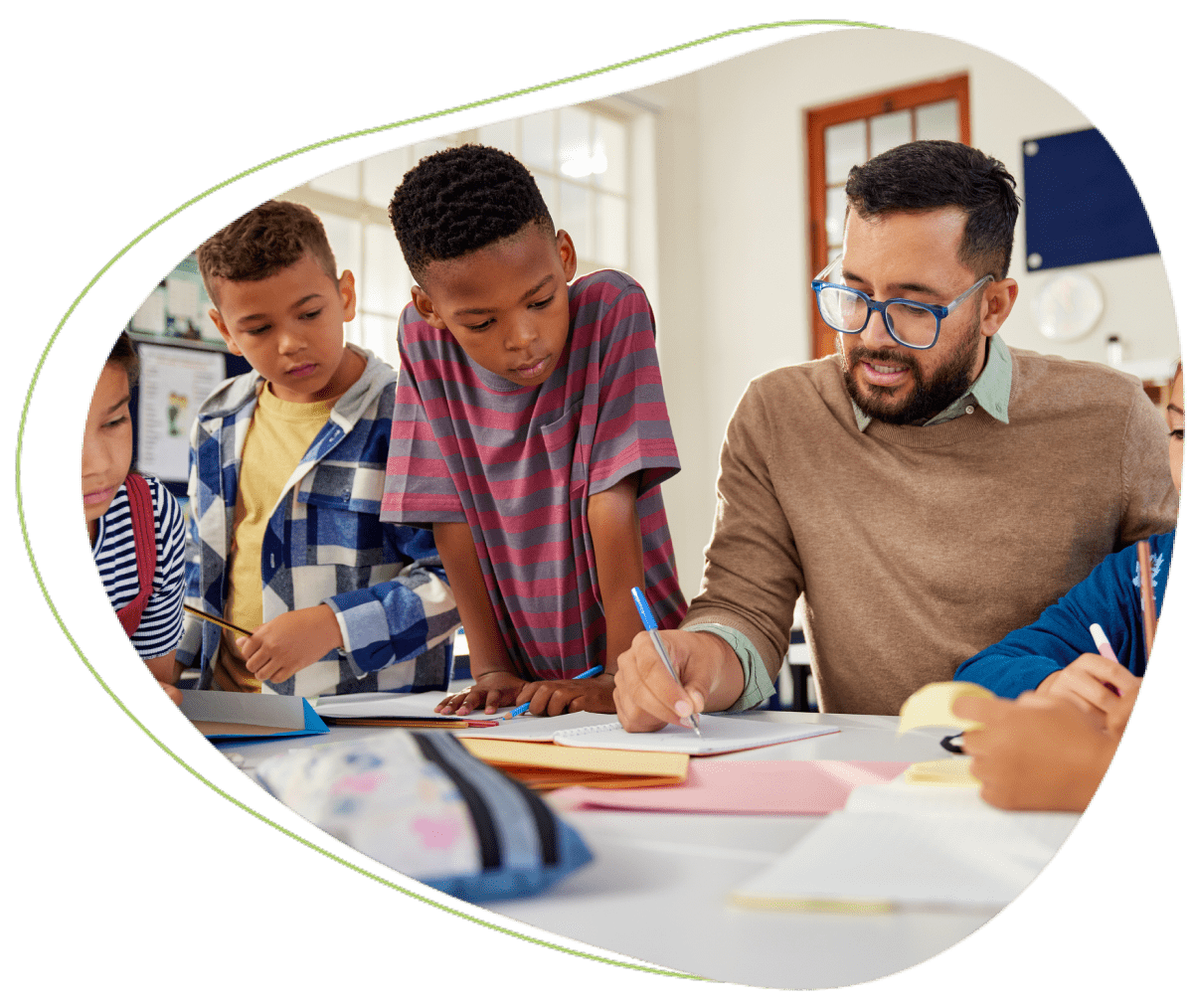 Teacher helping students with their work.