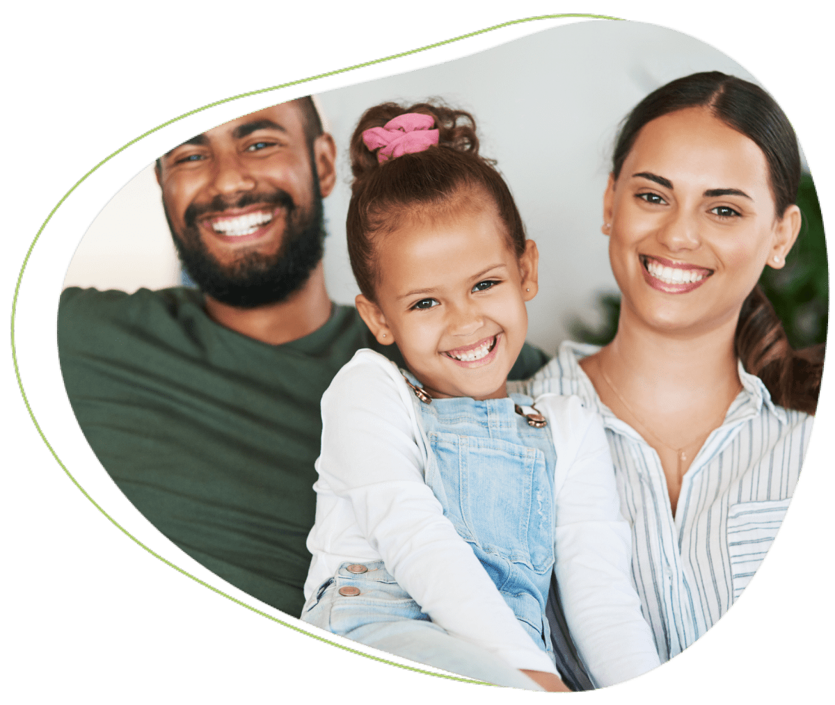 Smiling family posing together at home.